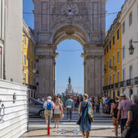 Ornate 18th-century triumphal arch with sculpted figures & views over the city center.
