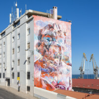 Mural by urban artist PichiAvo in Lisbon, near the Santa Apolónia train station.
