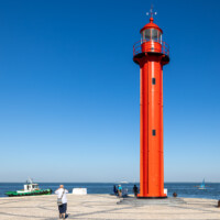 Across from Lisbon via the Cais do Sodré ferry.