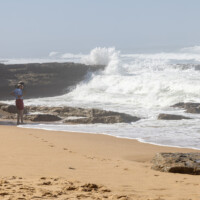 Pam and crashing waves at Praia de São Sebastião