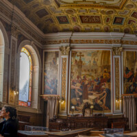 The Court Room with grand murals depicting court proceedings in ancient times.