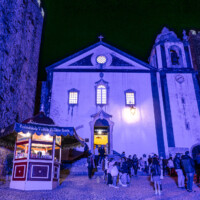 Light show on the walls of the castle and the church-turned-bookstore.